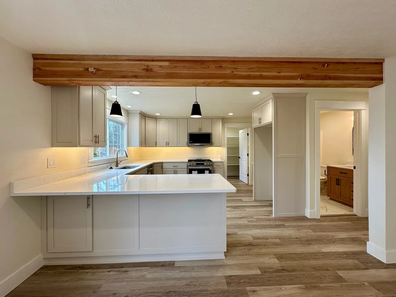 Martinsen Construction, finished kitchen remodel with open layout and wood beam, Central Oregon